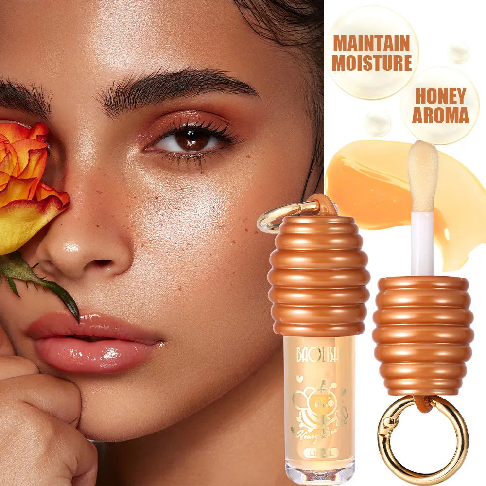 Honey lip gloss in portable keychain container for moisturising lip care