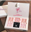 Butterfly box makeup set showing lip muds, powder blusher and necklace