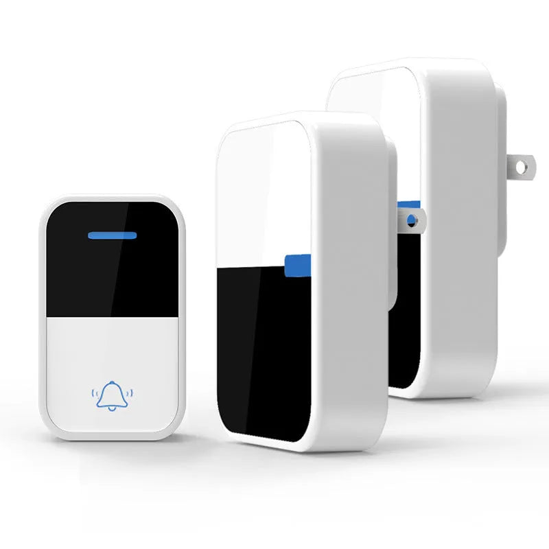 White plastic wireless doorbell receiver and self-generating button on a white background.