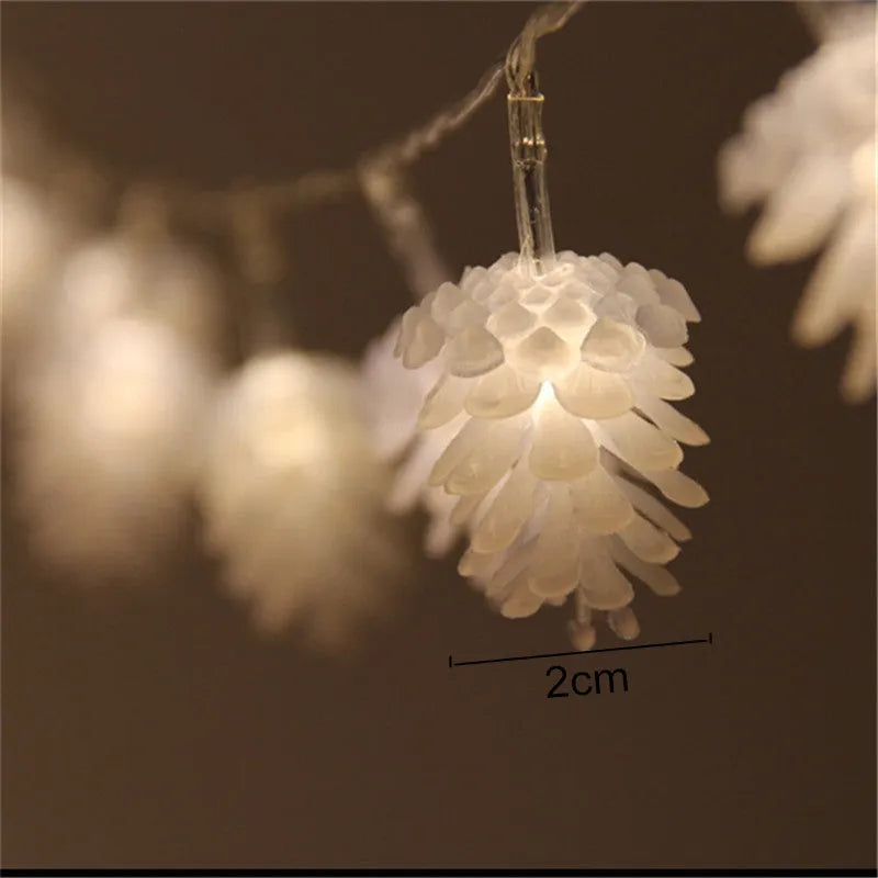 Battery-powered warm white LED pine cone light string for decorative indoor and outdoor use