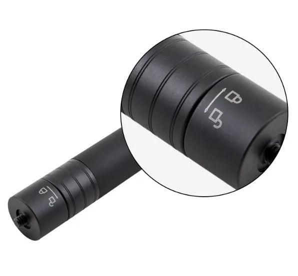 Black aluminium retractable selfie stick extended to full length with phone attached, showing included tripod stand and wireless remote.