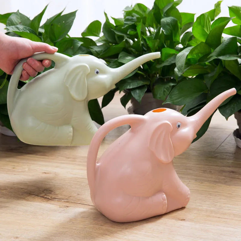 Pink children's watering can in shape of baby elephant with long nozzle and handle.