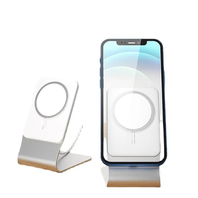 Silver aluminium alloy wireless charging stand holding a phone upright on a desk