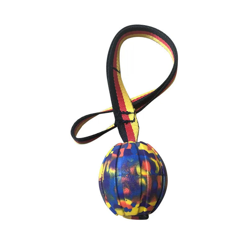 Floating camouflage and yellow EVA pet training ball with knotted tether in three diameter sizes for water retrieval