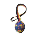 Floating camouflage and yellow EVA pet training ball with knotted tether in three diameter sizes for water retrieval
