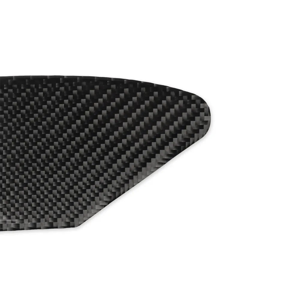 Carbon fibre decorative sticker panel for covering USB and charging ports on electronic devices.