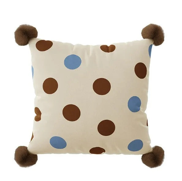 Blue cartoon animal print cushion and matching pillowcase on a sofa