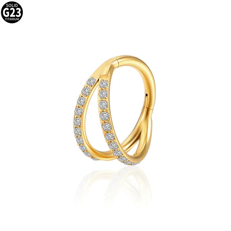 G23 titanium alloy lip and nose ring body jewellery with a zircon stud in gold or steel colour.