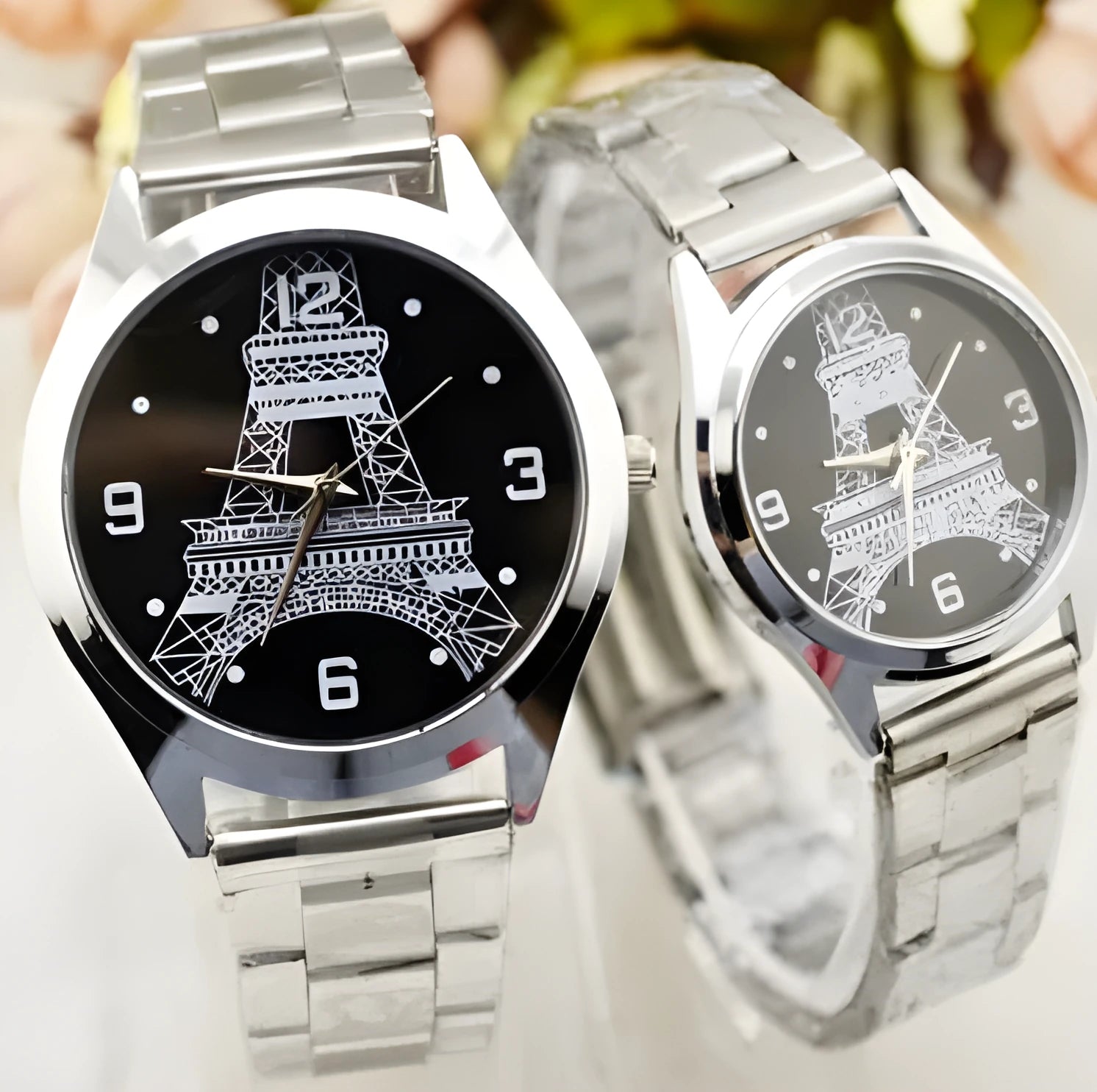 Blue dial Eiffel Tower wristwatch with leather strap on stainless steel buckle.
