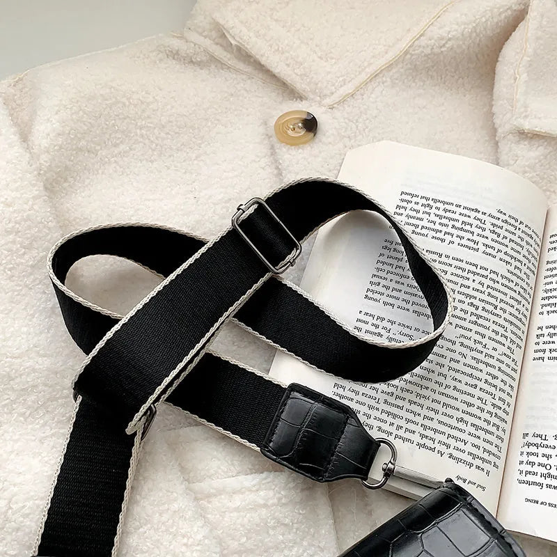 Vintage style crossbody bag in PU leather, shown in black, dimensions 20cm by 14cm.