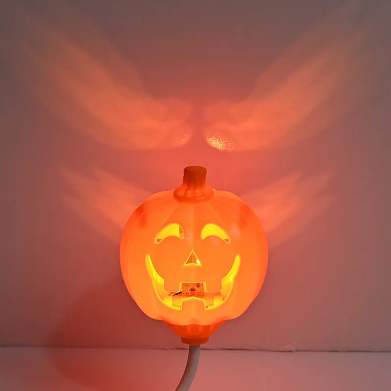 Plastic pumpkin-shaped lamp with USB charging cable, showing purple light option.