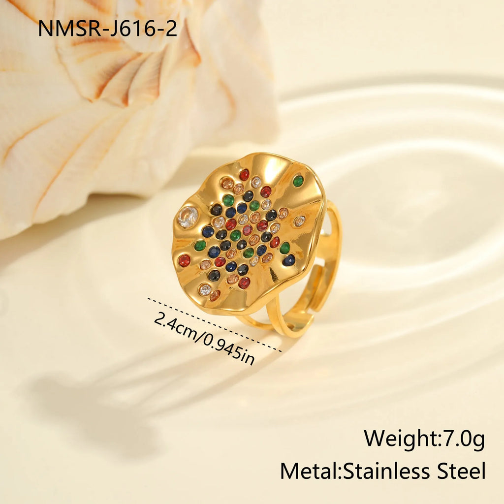 Geometric titanium steel ring with pleated band and coloured crystal inlays, open-mouth adjustable design