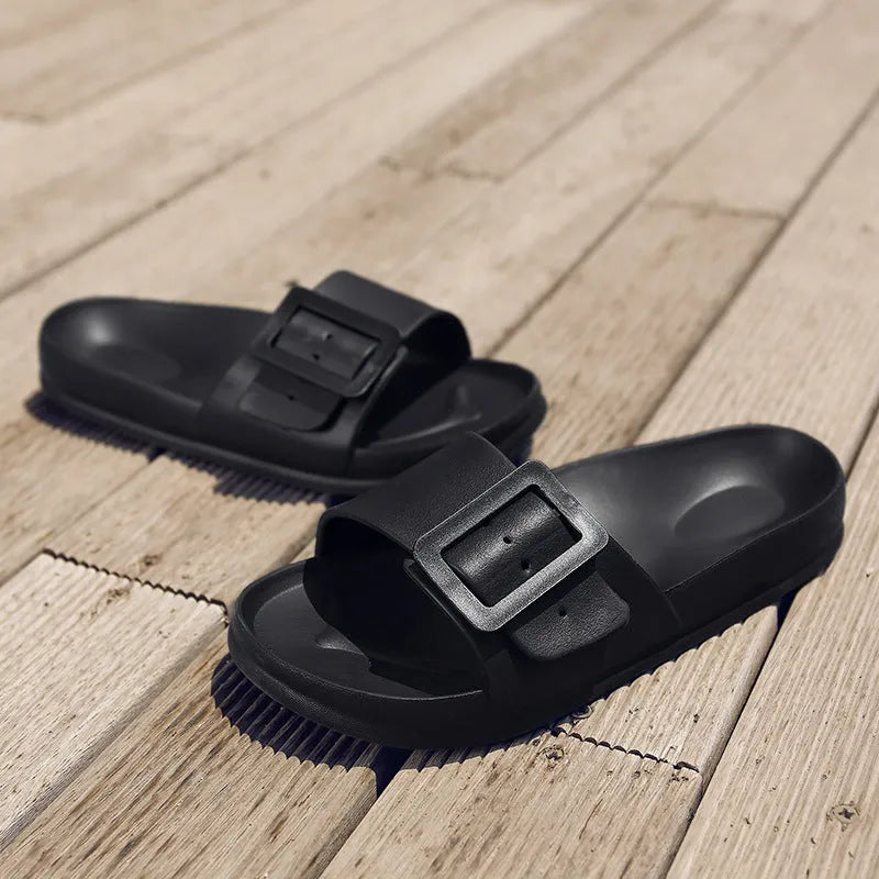 Women's grey blue flip-flop slippers with a single buckle and soft EVA sole.
