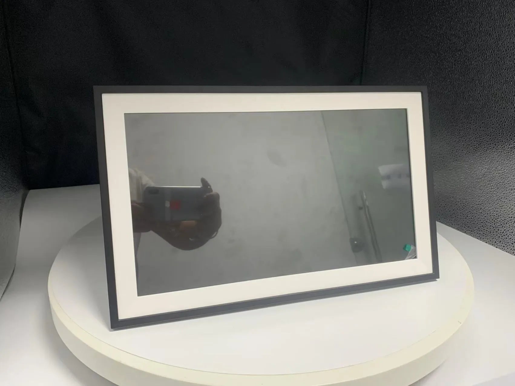 White 15.6 inch smart digital photo frame with Full HD screen on tabletop with mobile app connection
