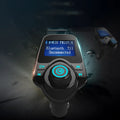 Black car Bluetooth FM transmitter and hands-free kit plugged into a 12V socket.