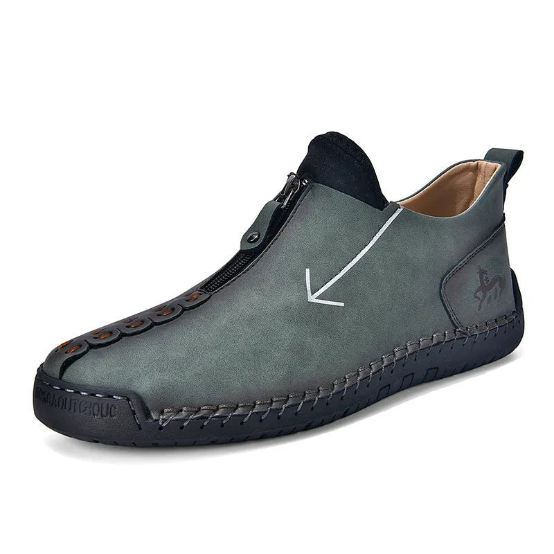 Men's black zip-up Martin boot with round toe and low heel on a white background.