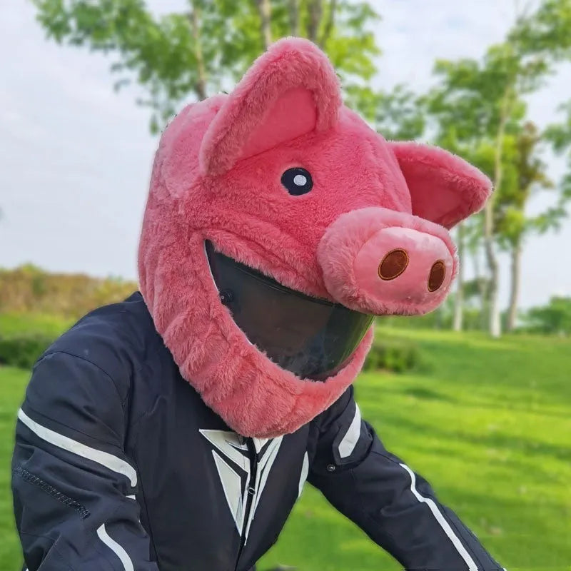 Pink plush cartoon-style protective hood for helmets on a white background.
