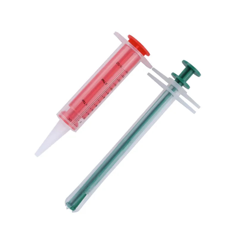 Two pet pill shooters with soft silicone tips for cat and dog medication administration