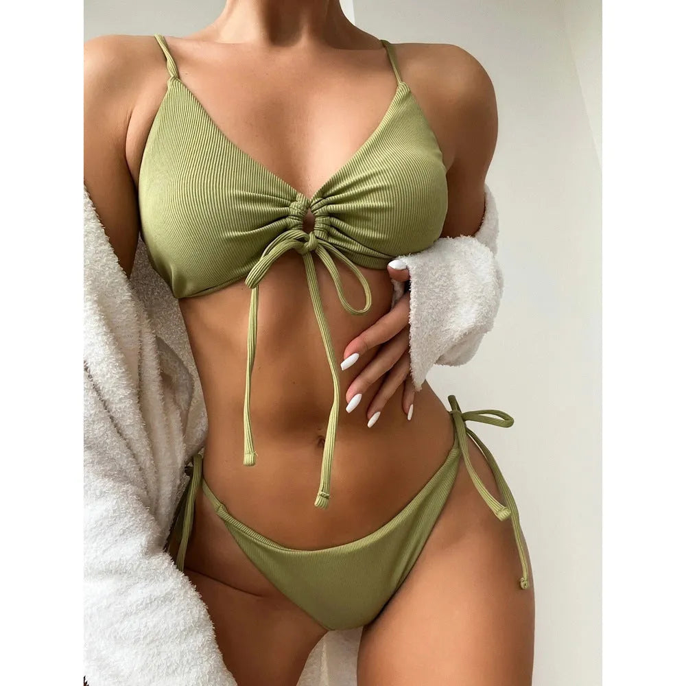 Women's solid colour drawstring bikini swimsuit in quick-dry fabric on a mannequin.
