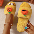 White and yellow Halloween pumpkin cartoon design open-toe plush slippers with synthetic fur.