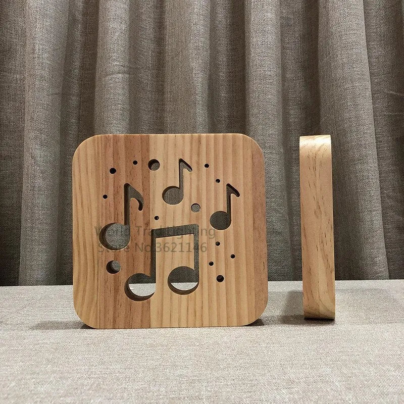 Square wooden LED atmosphere lamp with warm white light and USB cable on a desk