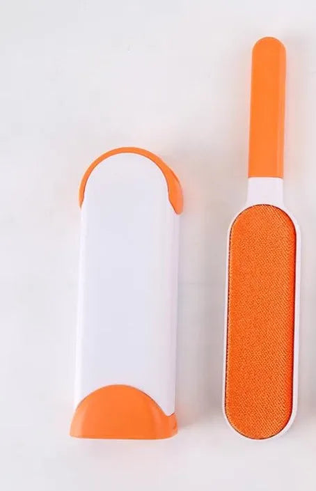 Blue reusable pet hair removal comb with double-sided flannel brush and self-cleaning base for sofas.