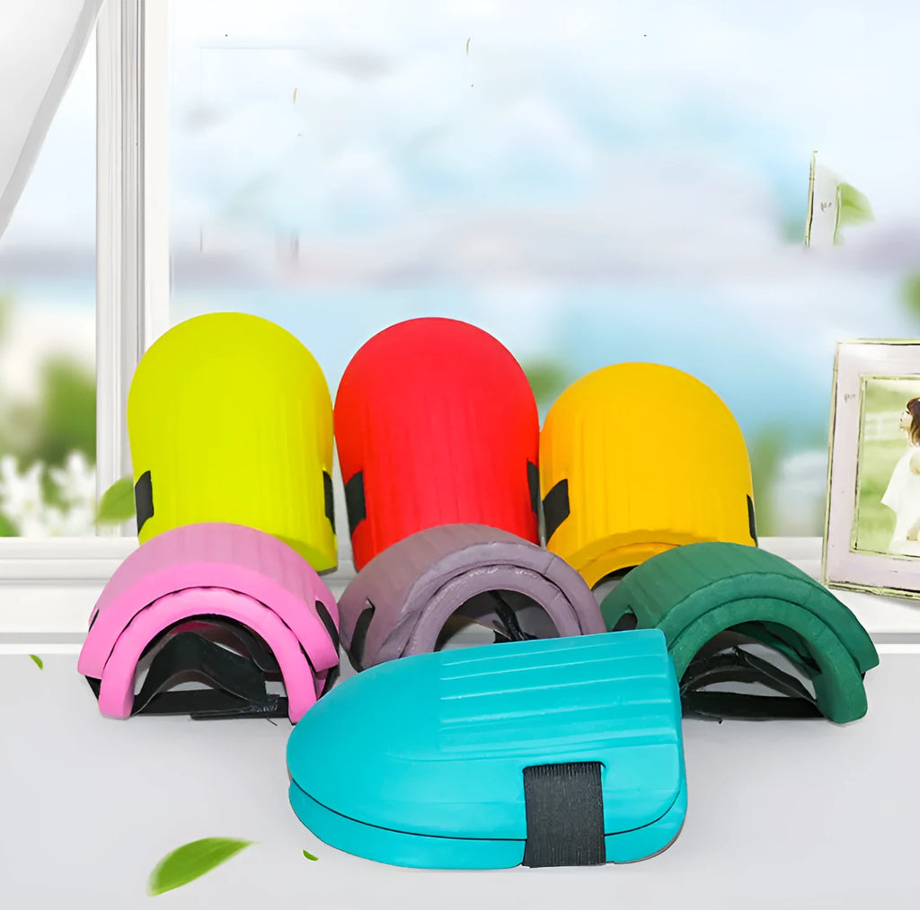 A pair of thick EVA foam kneepads in army green colour on a garden soil background.