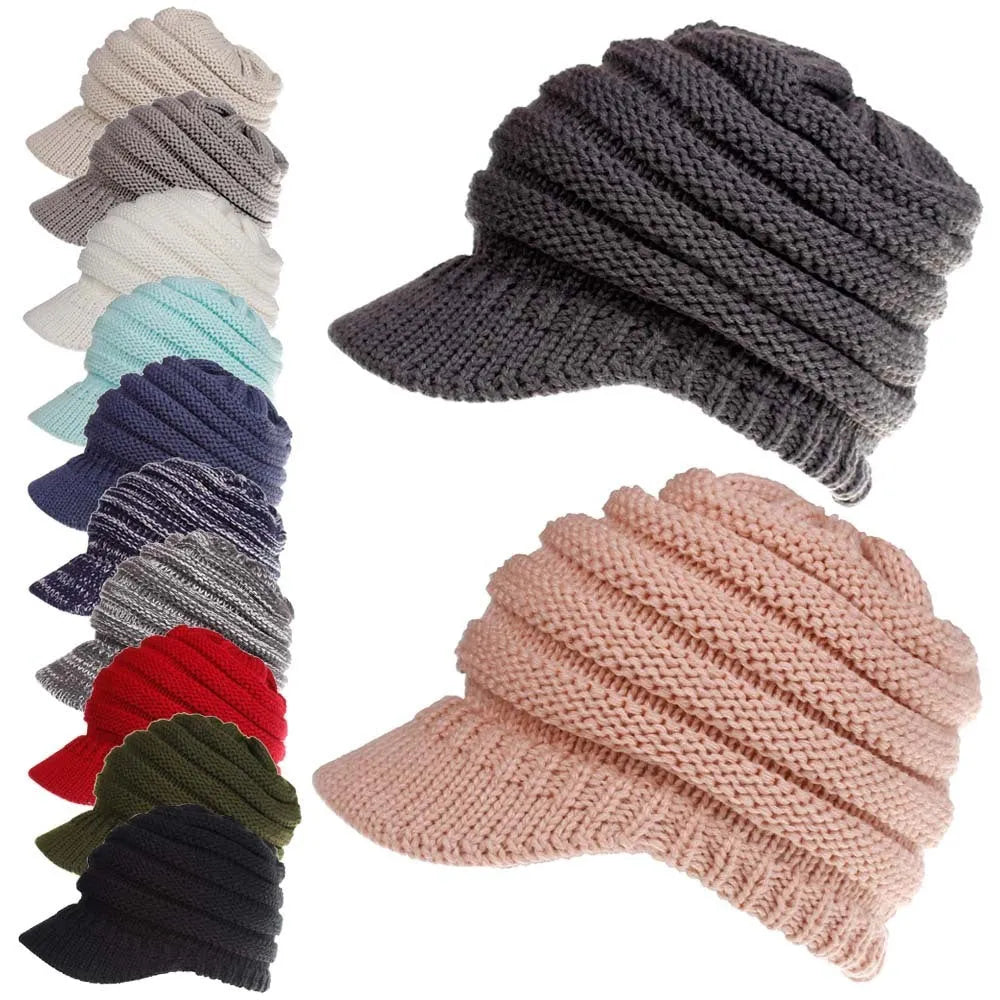 Woman wearing a soft knitted beanie with a ponytail pulled through the hole at the back.