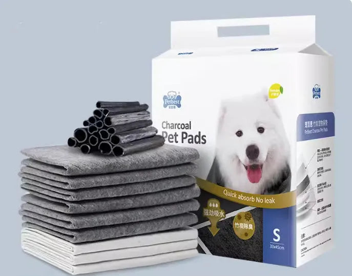 Pack of thickened dog urine pads showing adhesive strips and size comparison between S, M, L, and XL options