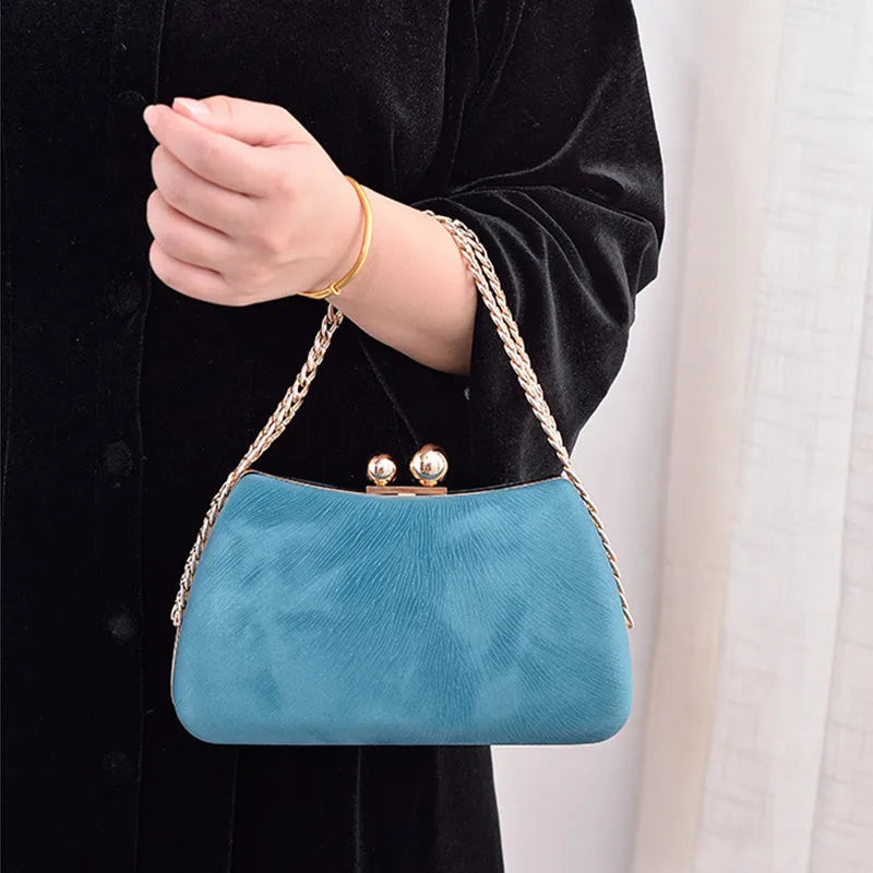 Embossed PU leather pillow chain shoulder bag in silver with lock closure