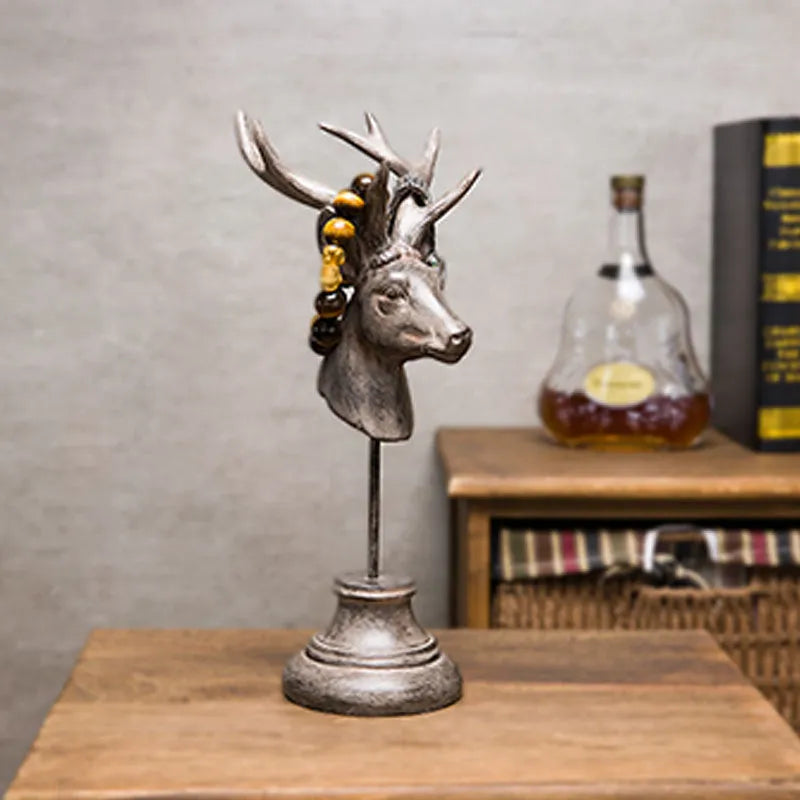 Natural resin decorative animal sculpture in black, white, or wood colour on a wooden table.