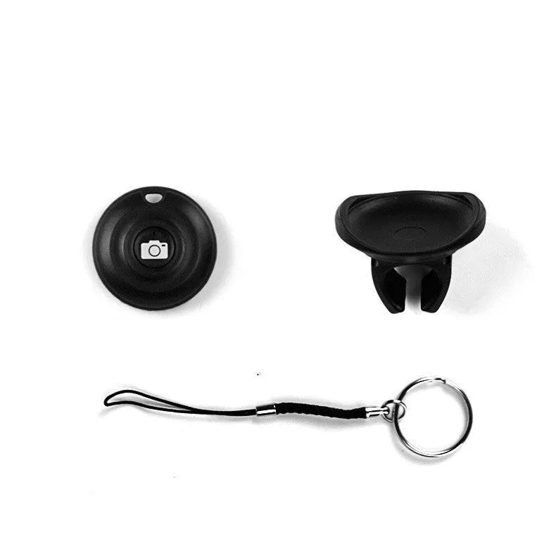 Black Bluetooth remote control for wireless smartphone camera photos and videos.