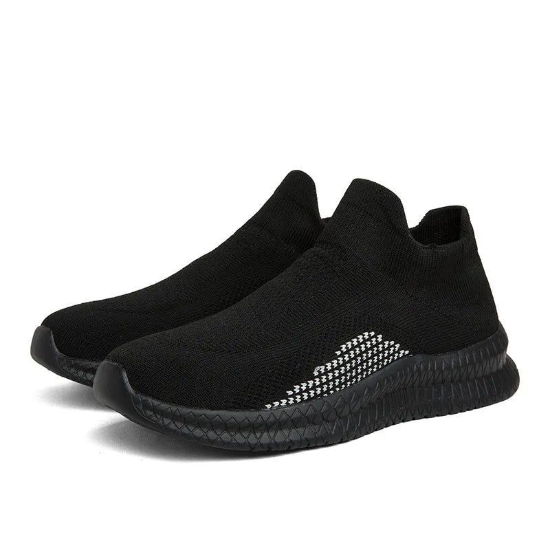 Popcorn Flyknit low top casual sneakers in white, black, and blue colours on a plain background.