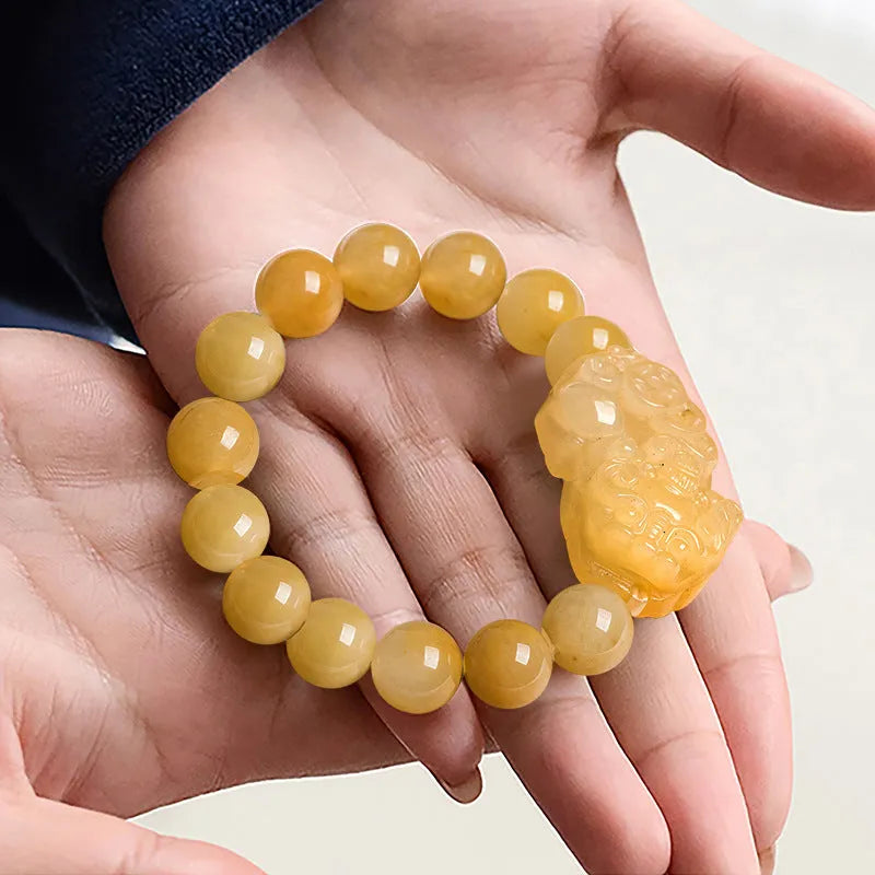 Carved Jinsi Jade money bracelet showing golden thread detail, displayed in large and small size options.
