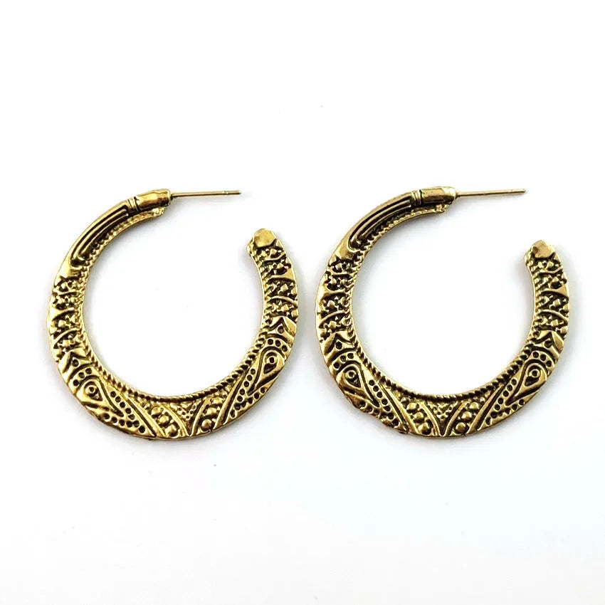Vintage bronze C-shaped alloy earrings with a distressed engraved surface texture.