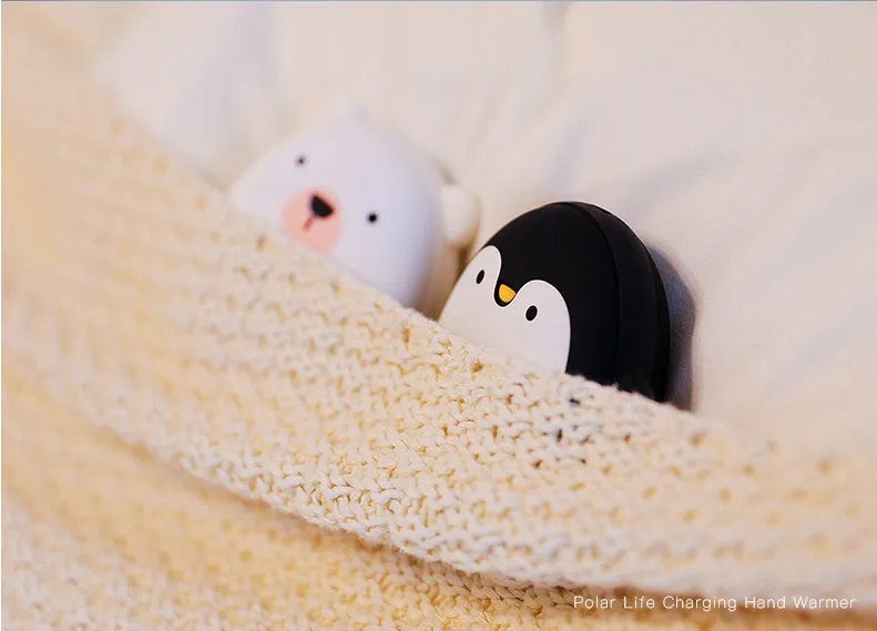 Cartoon penguin and polar bear USB rechargeable hand warmers showing front design