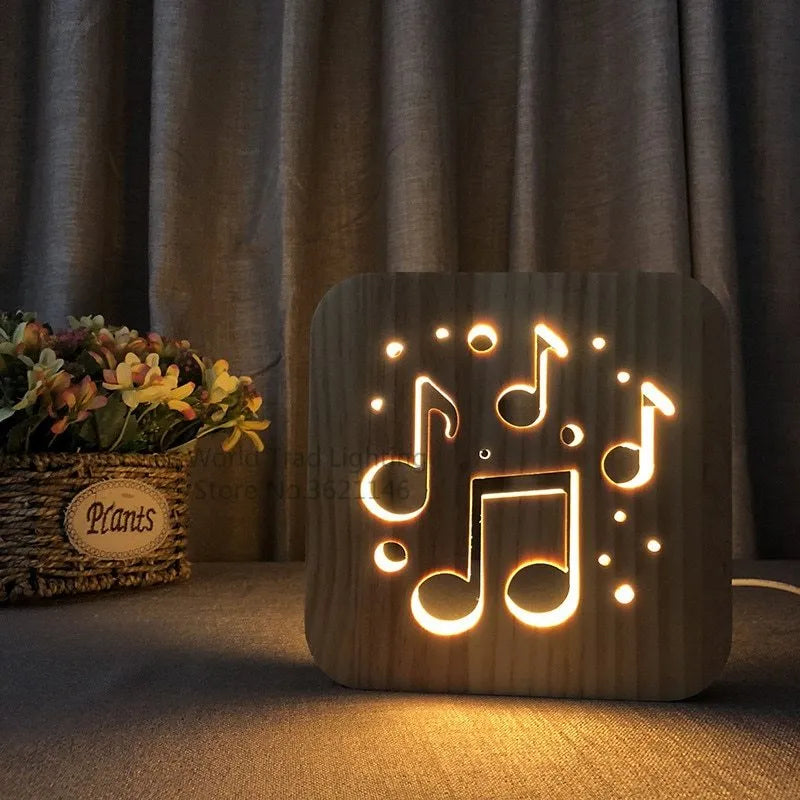 Square wooden LED atmosphere lamp with warm white light and USB cable on a desk