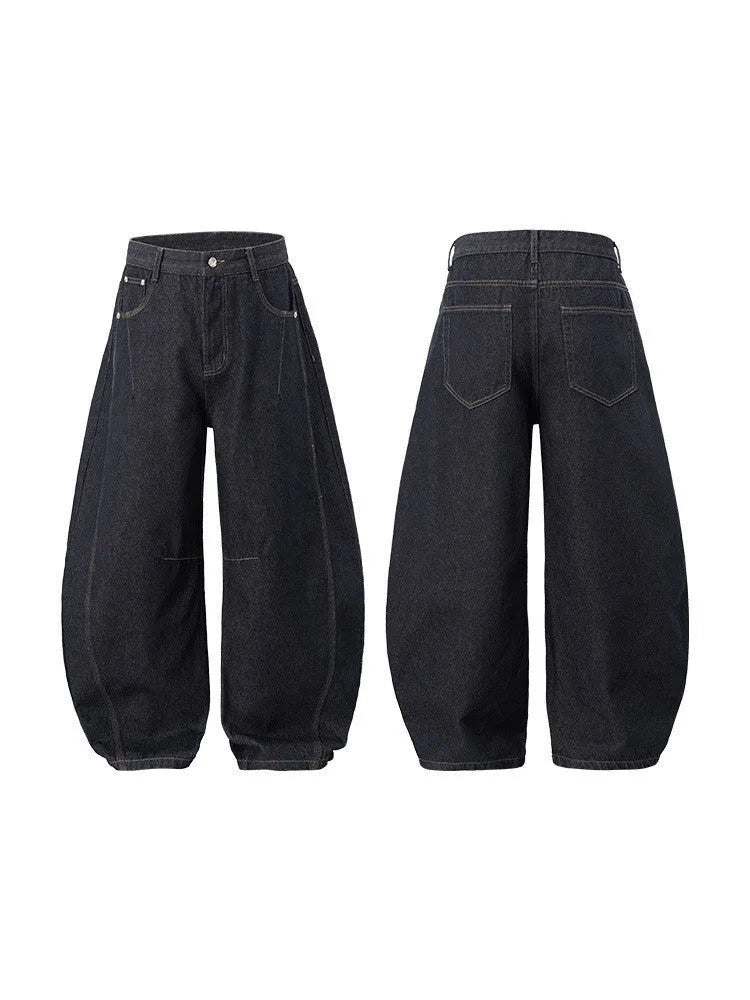 Men's original cow coloured wide leg denim trousers with a mid waist, laid flat.