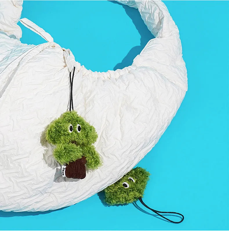 Plush pine tree-shaped cat toy with mint filling, shown in three available sizes for feline biting and grinding play.