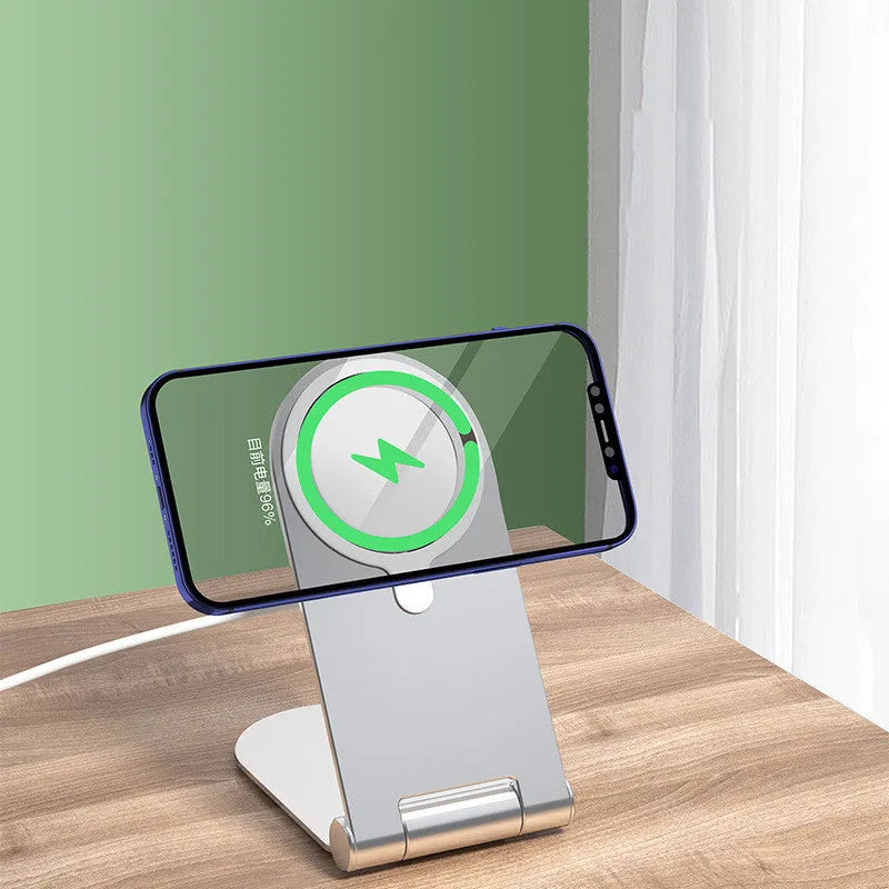 Silver vertical adjustable magnetic phone bracket for iPhone12 on a grey background.