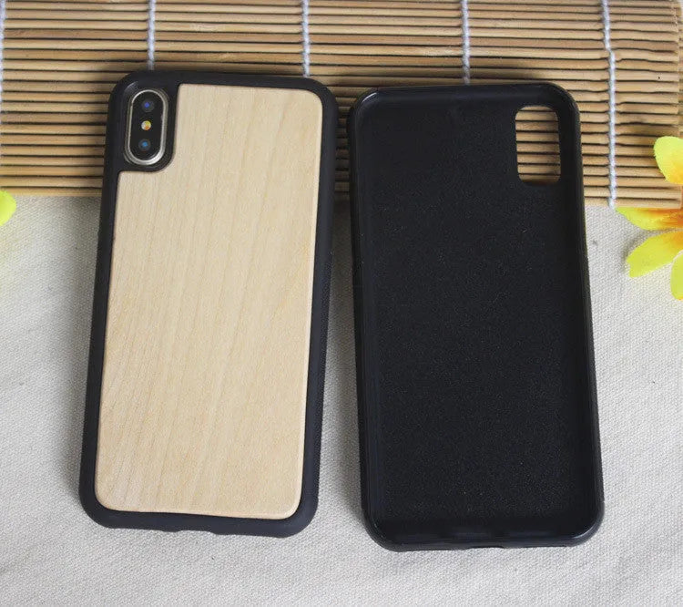 Wooden carbonised bamboo and black TPU bumper case for iPhone on a wooden table.