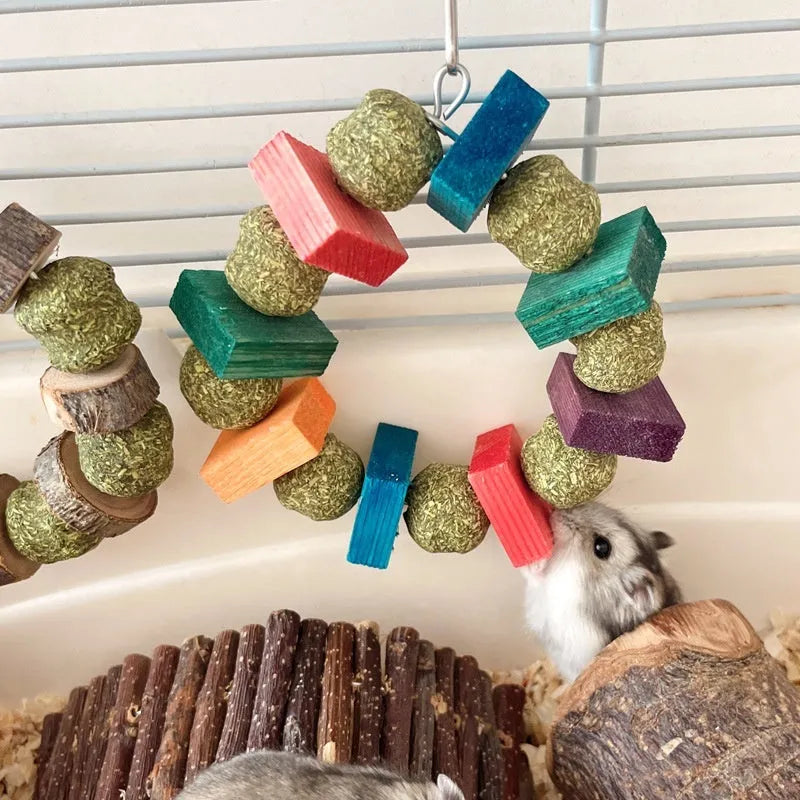 Hamster chew toy featuring straw ball ring design in colourful sequin or natural applewood finish