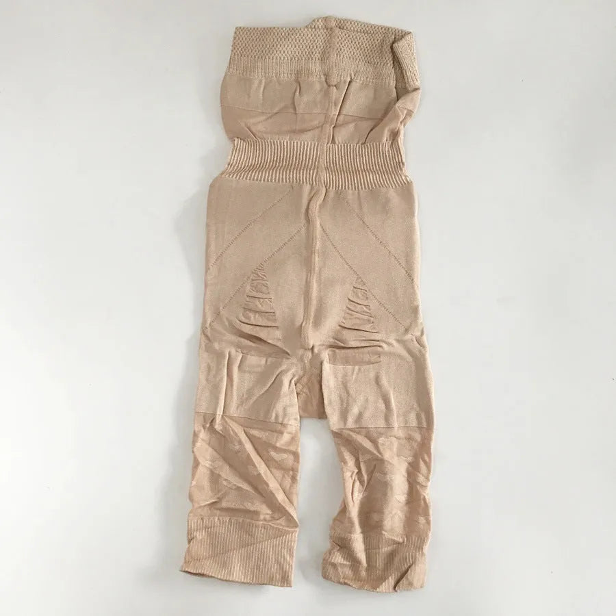 Women's black seamless high waist shapewear shorts laid flat, showing the tummy control panel.