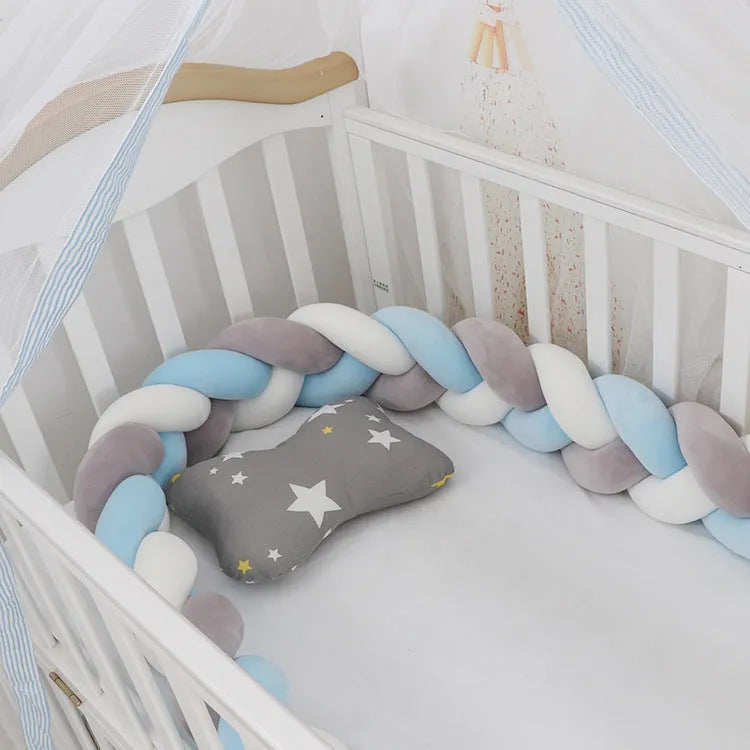 Soft spandex velvet baby crib bumper protector shown in a light grey colour, shaped around white crib bars.