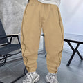 Men's blue bamboo fibre cropped sports trousers with a loose casual fit on a hanger.