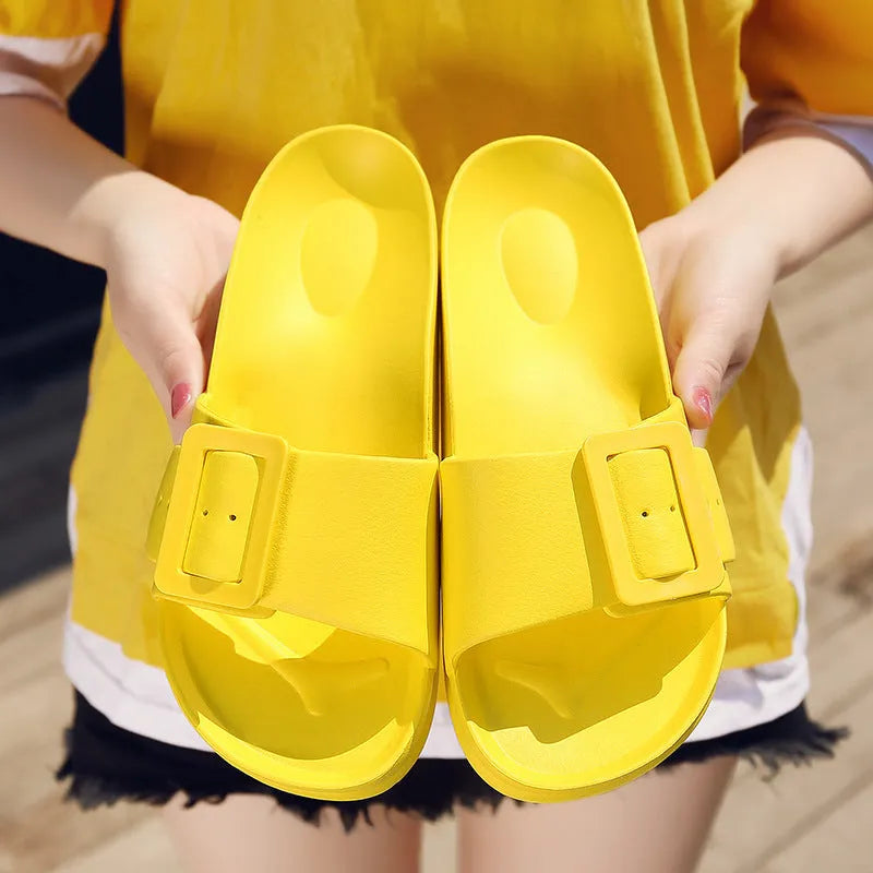 Women's grey blue flip-flop slippers with a single buckle and soft EVA sole.