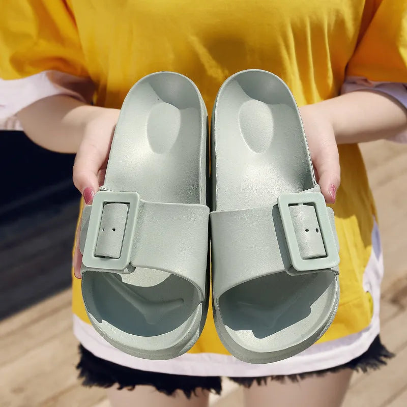 Women's grey blue flip-flop slippers with a single buckle and soft EVA sole.