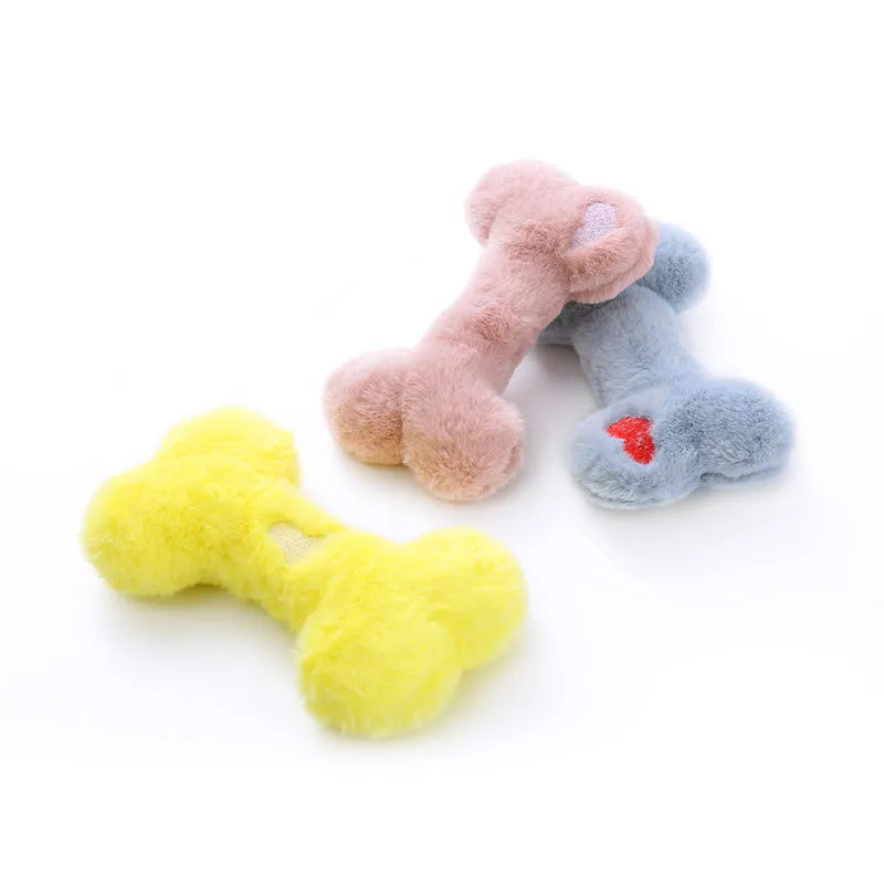 Blue plush love bone dog toy with a squeaker, shown next to pink and yellow versions.