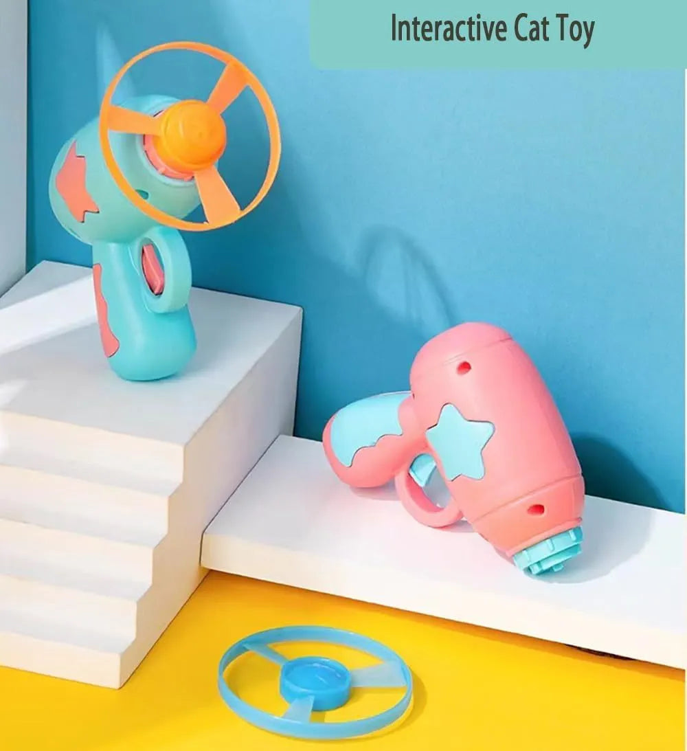 Blue and pink plastic cat toy gun with two frisbees for indoor play