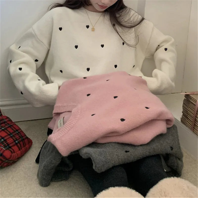 Women's loose fit cream pullover sweater with love heart embroidery detail on the front